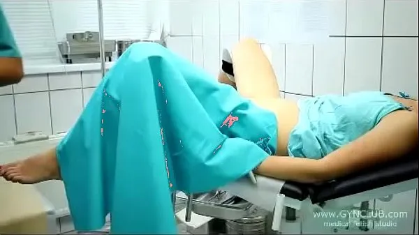 Verse beautiful girl on a gynecological chair (33 drive-tube